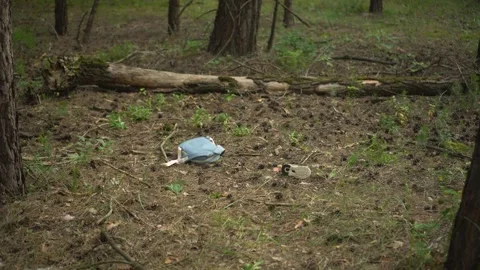 Abandoned Children's Backpack and Shoe in the Woods Evidence Stock Footage 343894171