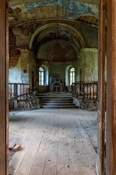 Abandoned church in Latvia, Galgauska, view through the entrance door to the  Stock Photos