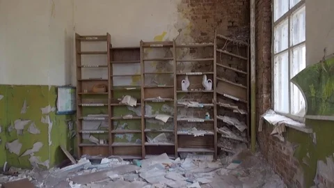 Abandoned class room and old book lying on floor kindergarten in Pripyat Ukraine Stock Footage 83203307