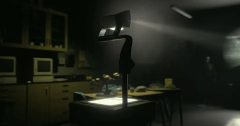 An abandoned classroom features an overhead projector in dim lighting Stock Footage 327618959