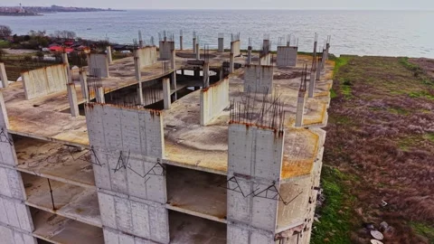 Abandoned coastal building with rusted structures and sea view Video stock 324520306