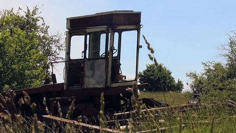 Abandoned combine in the meadow. Close up Stock Footage 97781812