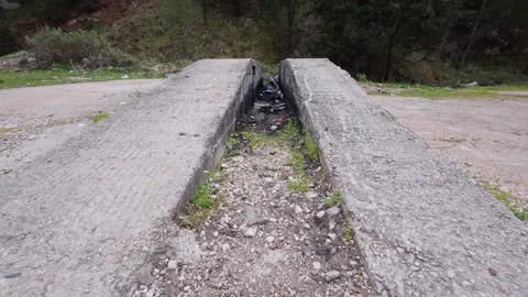 Abandoned Concrete Structure with Garbage and Oil in Forest Stock Footage 305234396