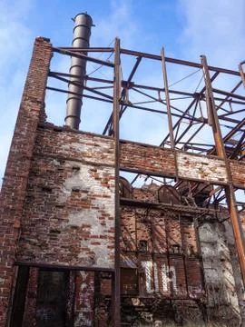 Abandoned construction brick with an old pipe Stock Photos