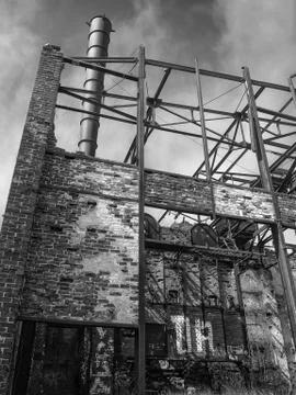 Abandoned construction brick with an old pipe black and white Stock Photos