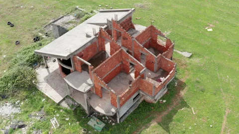 Abandoned construction site of lone red brick house Stock Footage 152950335