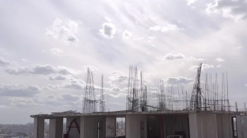 Abandoned construction site with rusty structure. unfinished skyscraper Stock Footage 163735495