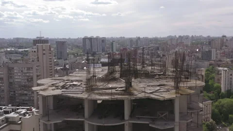 Abandoned construction site with rusty structure. unfinished skyscraper Stock Footage 163736472