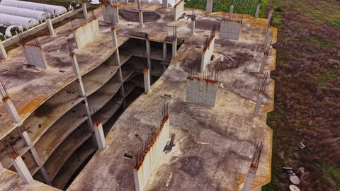 Abandoned construction site viewed from above showcasing decay and nature Video stock 324521666