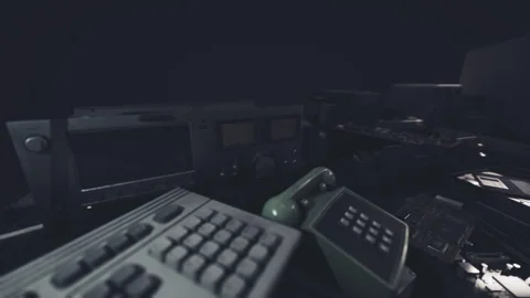 Abandoned control room filled with old electronic equipment in dim light 動画素材 310501174