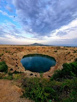 Abandoned copper mine of Tsar Asen, filled with turquoise blue water. Bulgaria Stock Photos