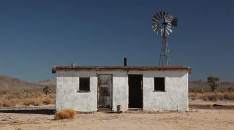 Abandoned Desert Ranch Adobe House with Windmill Stock Footage 33650274
