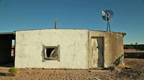 Abandoned Desert Ranch Adobe House with Windmill Stock Footage 33873068