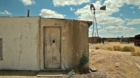 Abandoned Desert Ranch Adobe House with Windmill Stock Footage 33873173