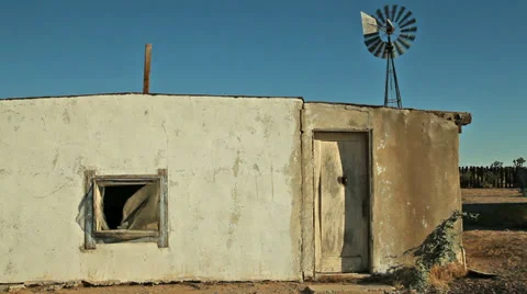Abandoned Desert Ranch Adobe House with Windmill Stock Footage 33873921