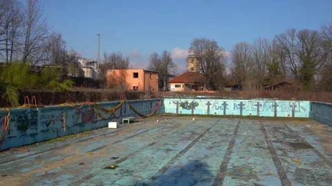 Abandoned empty outdoor Olympic pool Stock Footage 169575960