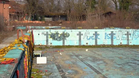 Abandoned empty outdoor Olympic pool Stock Footage 169576330