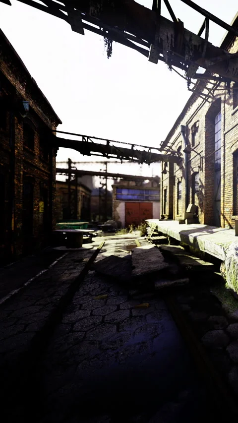 Abandoned factory site with broken structures and debris in daylight Stock Footage 335968323