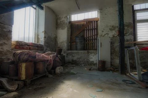 Abandoned factory space with storage objects Stock Photos
