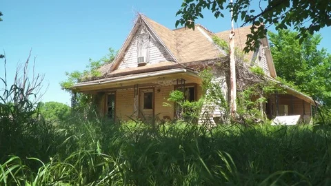 Abandoned Farm House Low Angle In Grass Stockbeeldmateriaal 79807114