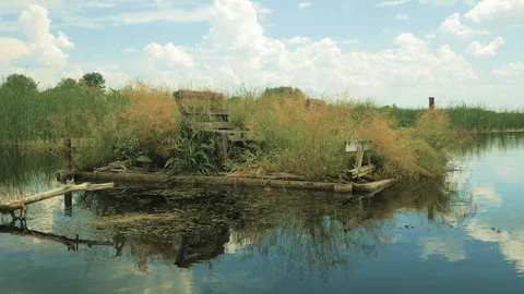 Abandoned fishing spot on the water Stock Footage