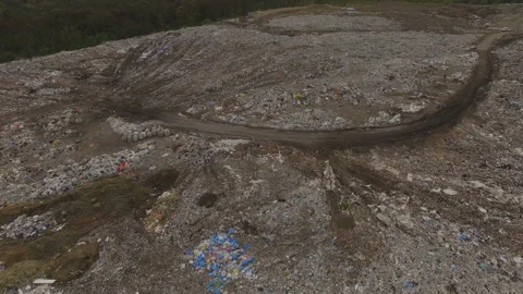 Abandoned flooded garbage city dump. Garbage on the banks of the river Stock Footage 168495837