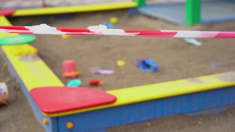 Abandoned, forgotten, closed playground close up. Quarantine period outdoor. Stock Footage 131477593