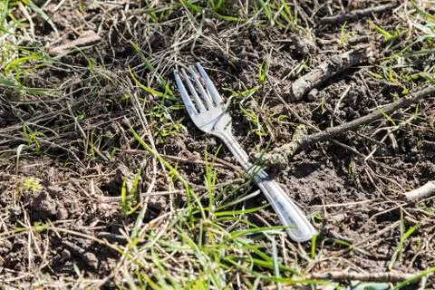 Abandoned fork on the floor outside Stock Photos