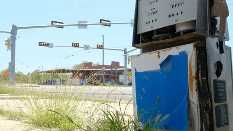 Abandoned gas station with intersection in the background Stock Footage 109514351