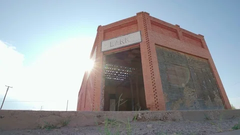 Abandoned Ghost Town Brick Bank with Sun Flare Stock Footage 80834039