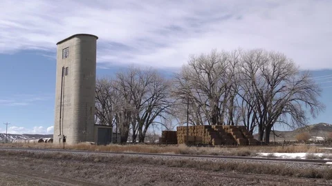 Abandoned Grain Elevator Silo by Railroad Track Old and Empty in Wyoming Stock Footage 130021834
