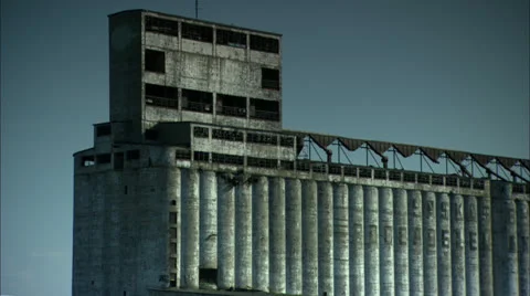 Abandoned Grain Elevator Zoom out to activity on Lake Erie Beach HD Video Stock-Footage 24614743