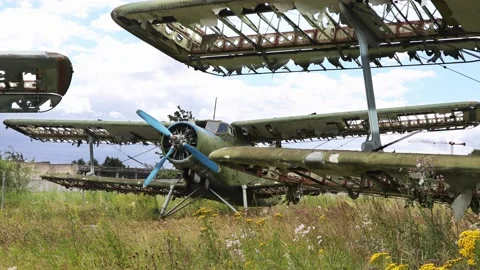 Abandoned green small propeller plane. Airplane graveyard Video stock 137285331