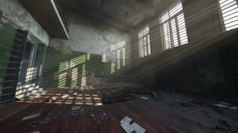 Abandoned gymnasium with sunlight casting shadows on the floor Stock Footage 308529189