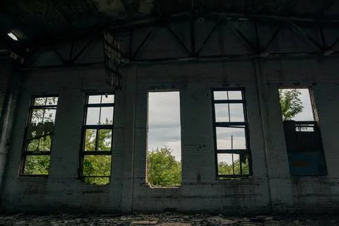 Abandoned hangar with broken windows Stock Photos