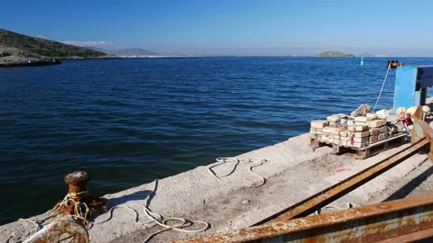 Abandoned hardware in a Mediterranean pier Video stock 136900222