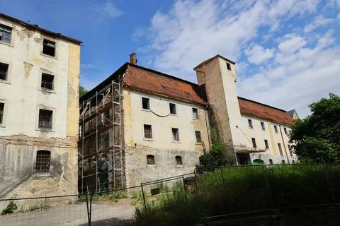 Abandoned historic building under partial renovation Stock Photos