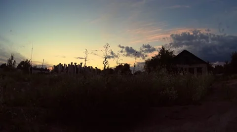 Abandoned house and column in high grass field, golden sunset Video stock 68908907