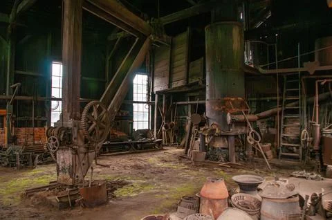 Abandoned Industrial Forge Workshop Showcasing Vintage Machinery and Tools .. Stock Photos