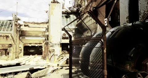 Abandoned industrial site with decayed structures and scattered debris Illustrazione stock