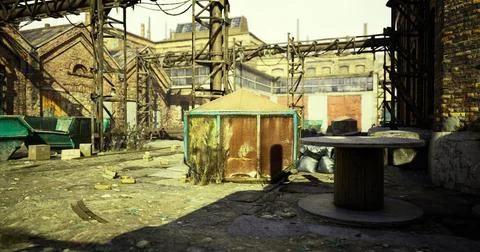 Abandoned industrial site with rusty structures and debris in daylight Illustrazione stock