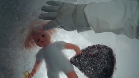 Abandoned laboratory setting with glinting ice and cautious inspection. Silent Stock Footage 346522634