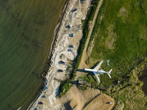 An abandoned large plane on the background of a blue warm sea, footage taken fro Stock Photos