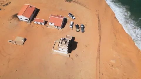 Abandoned lighthouse on sandstone cliffs on Angola coast Stock Footage 310664449