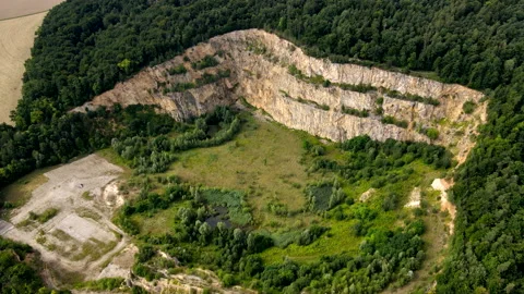 Abandoned lime stone quarry pit, Aerial Drone view in 4k, renaturation Video stock 159069308