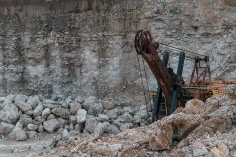 Abandoned machinery on an old abandoned open limestone quarry Stock Photos