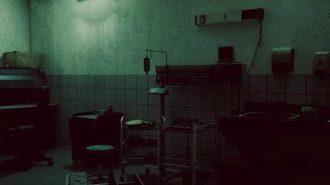 An abandoned medical facility with outdated equipment and dim lighting Stock Footage 293435539