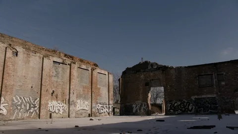 Abandoned middle of demolished brick building winter - camera unsettled Stock Footage 89944896