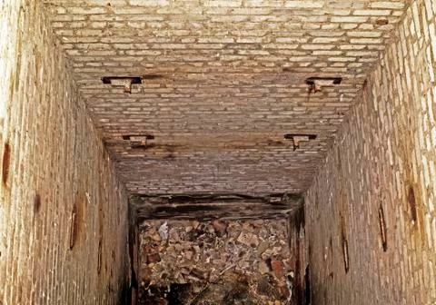 Abandoned mine freight Elevator after the disposal of an industrial building. Stock Photos