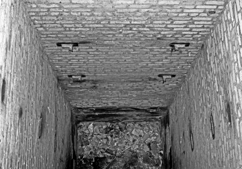 Abandoned mine freight Elevator after the disposal of an industrial building. Stock Photos